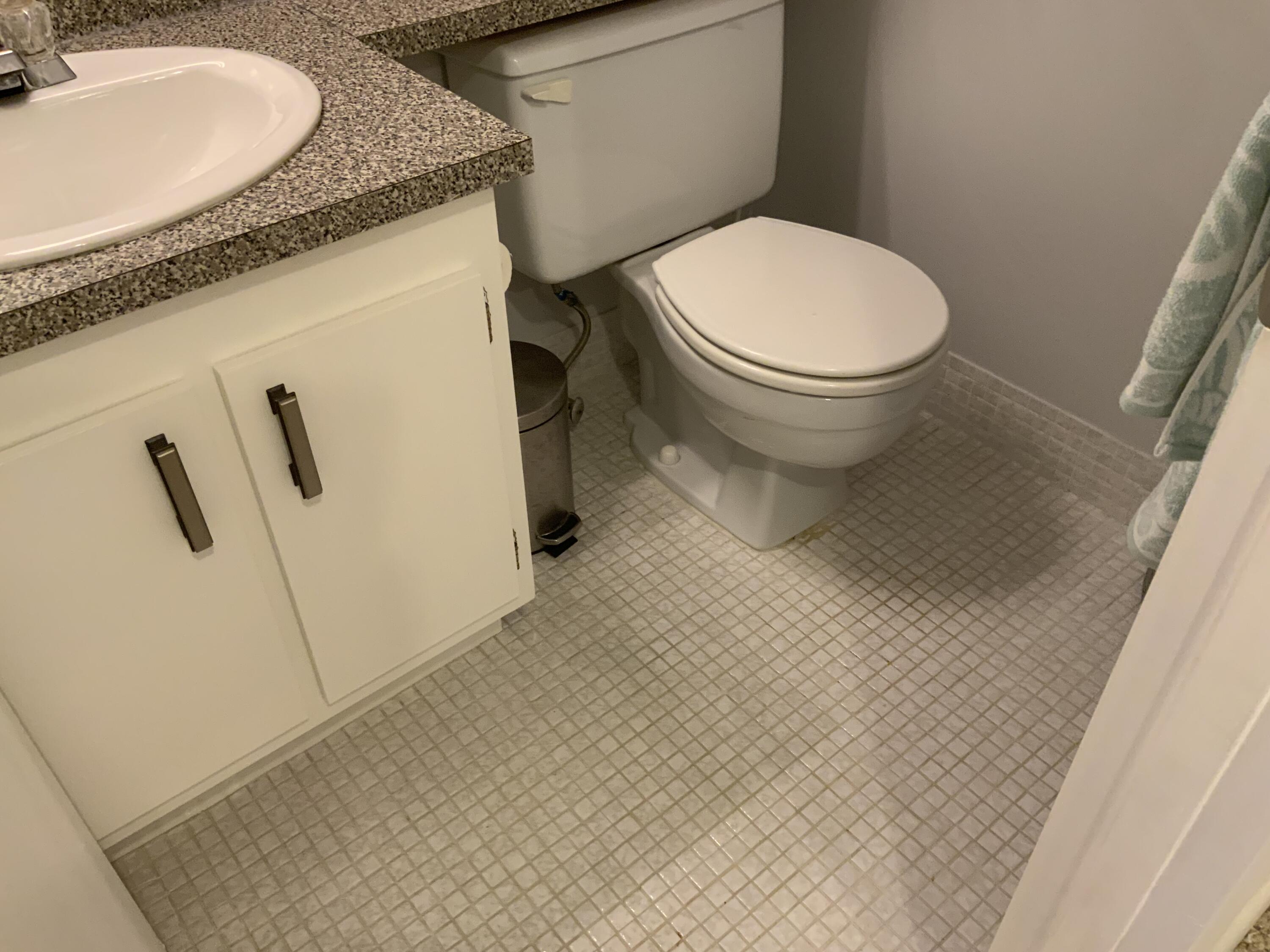 353 Dorset I Boca Raton, FL 33434 - Photo 16 of 30 a bathroom with a granite countertop toilet and a sink