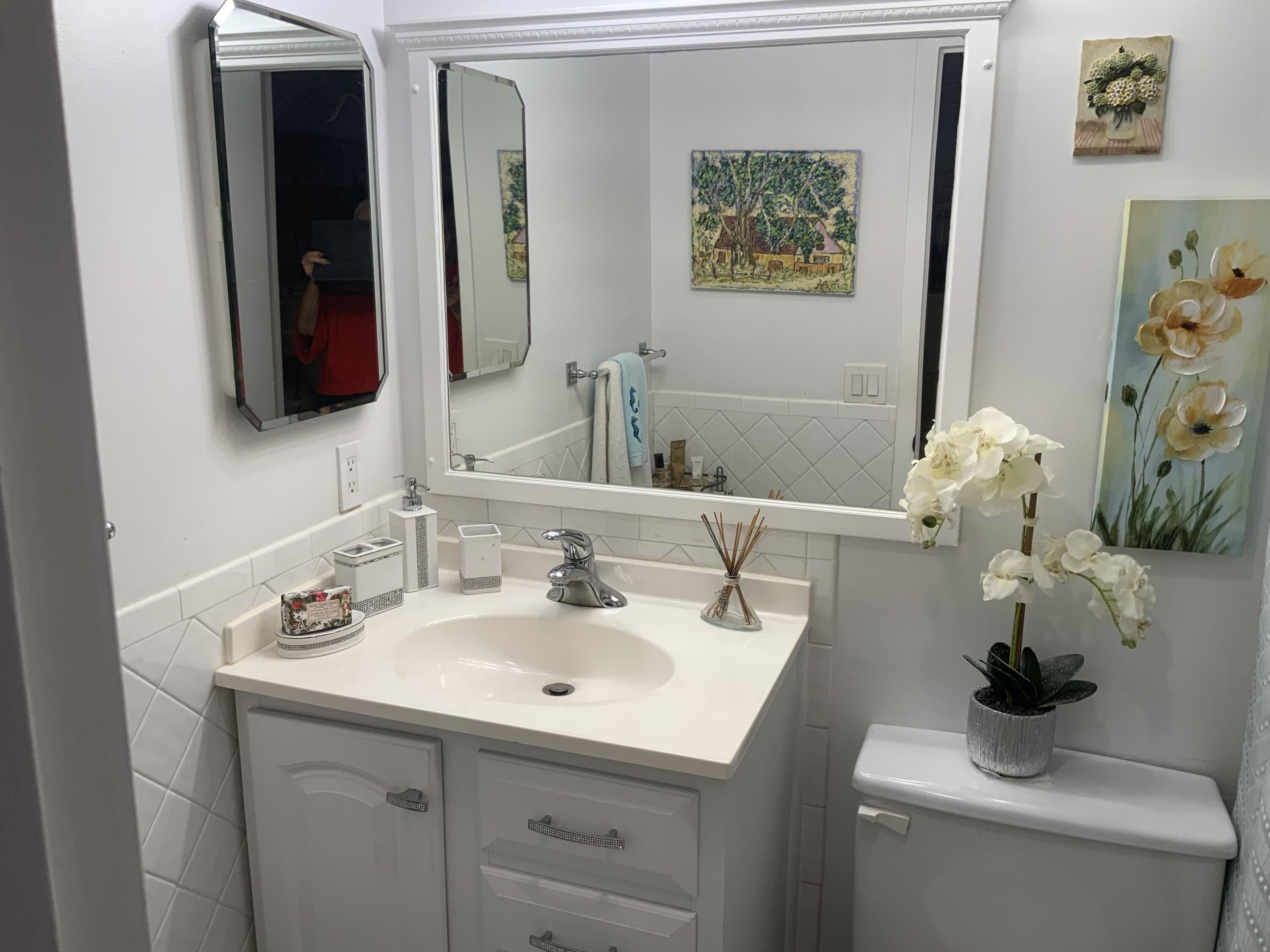 353 Dorset I Boca Raton, FL 33434 - Photo 21 of 30 a bathroom with a sink and a mirror