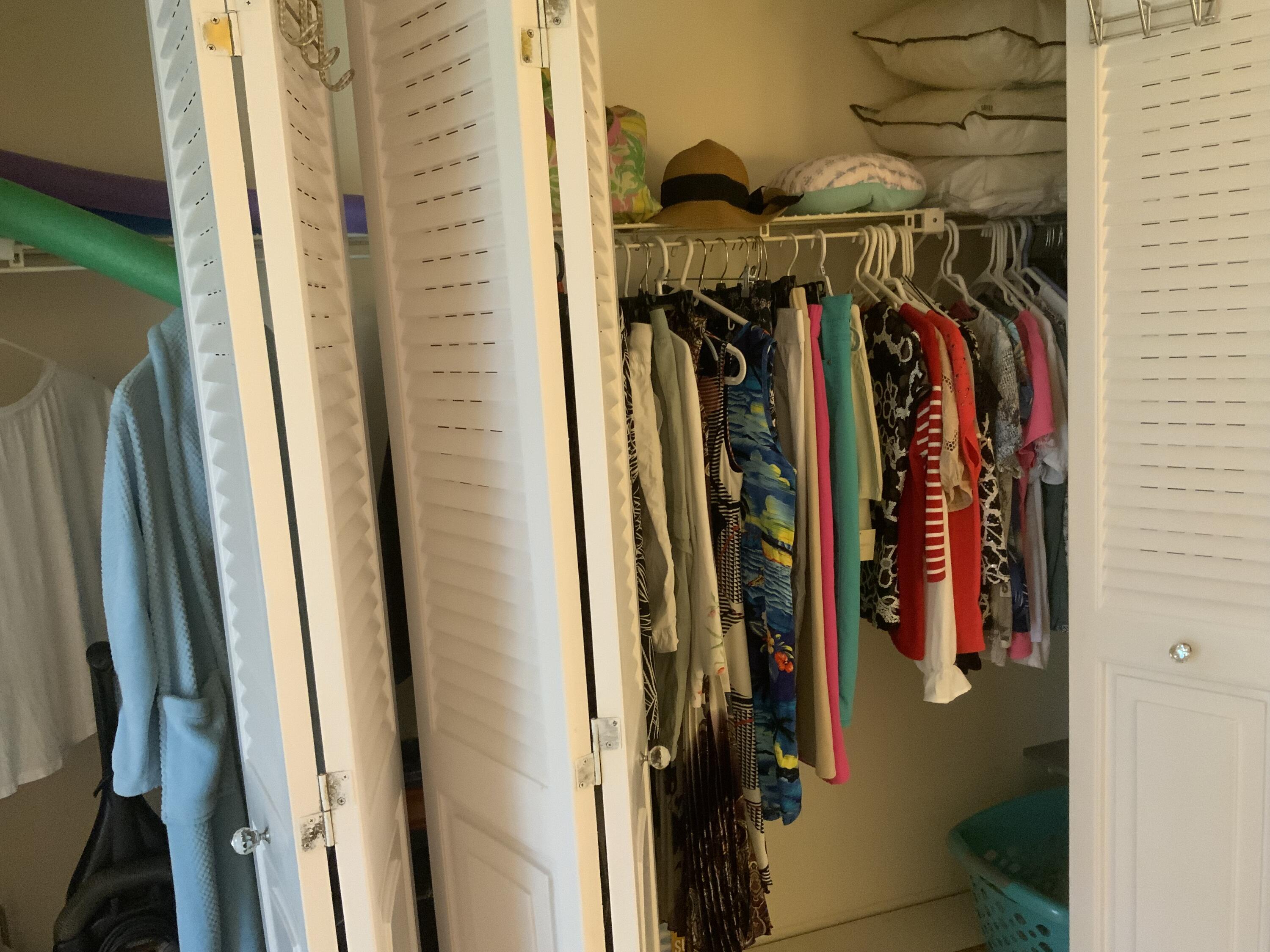 353 Dorset I Boca Raton, FL 33434 - Photo 24 of 30 a view of walk in closet with clothes