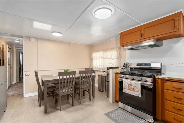 a view of a kitchen with dining table and chairs