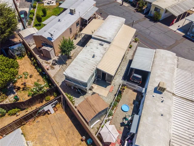 an aerial view of a house with outdoor space