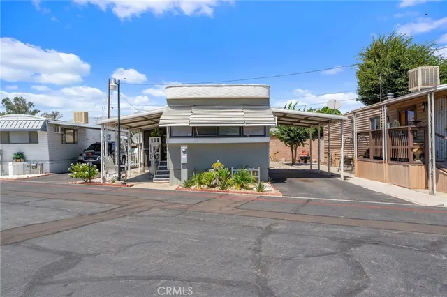 a view of a chair and tables in the patio