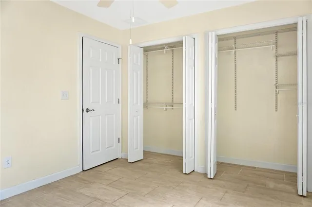 an empty room with closet area