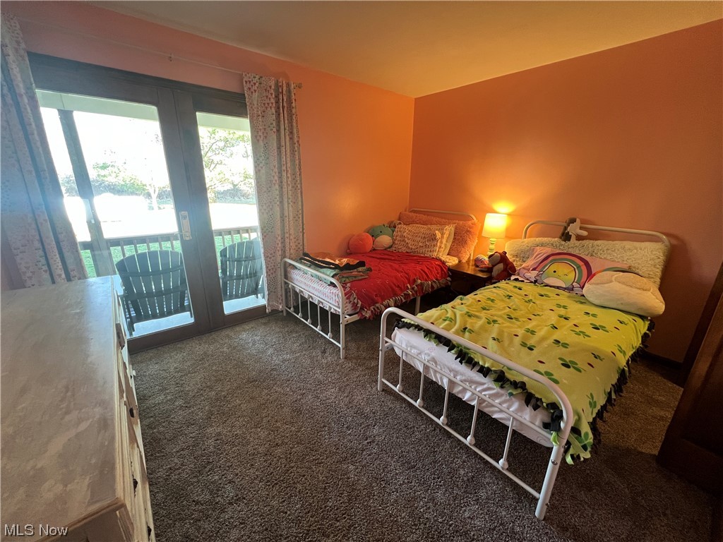 4512 Tabor Ridge Road Northeast Mineral City, OH 44656 - Photo 17 of 44 Carpeted bedroom featuring access to exterior