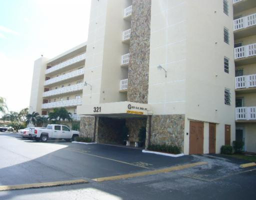 a view of a building and car parked