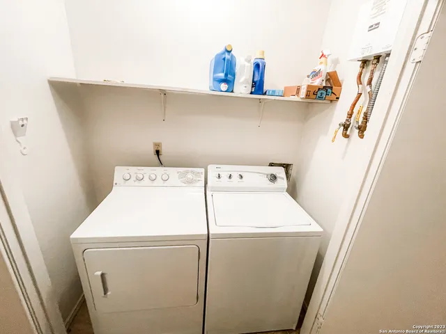 a utility room with dryer and washer