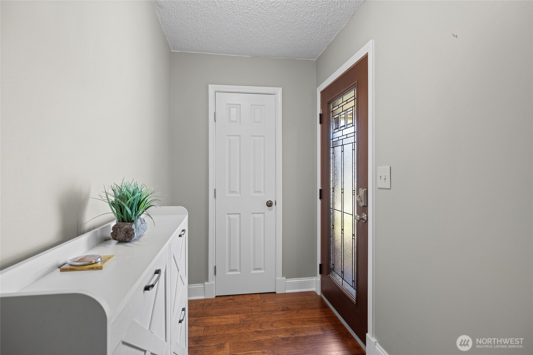 415 Sterling Street Sedro-Woolley, WA 98284 - Photo 7 of 38 a view of hallway with window and wooden floor