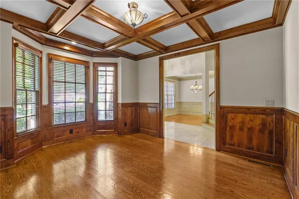 a view of an empty room with glass door