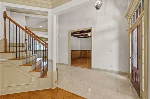 a view of an entryway with wooden floor