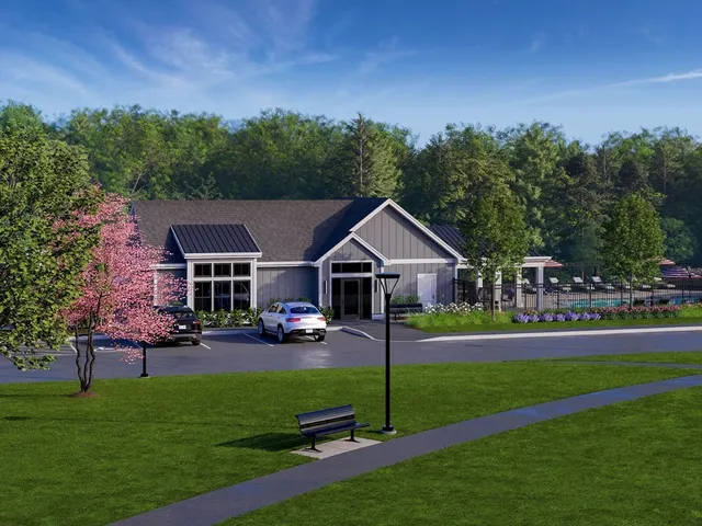 an aerial view of a house with garden space and street view