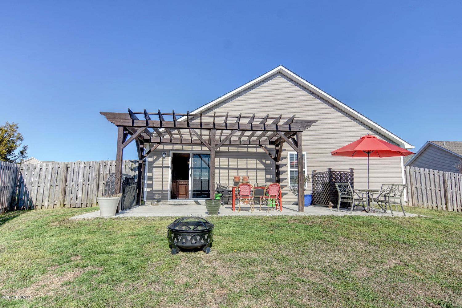 320 Rose Bud Lane Holly Ridge, NC 28445 - Photo 30 of 36 Lovely pergola covering the patio