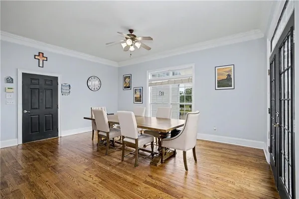 a view of a livingroom with workspace and a window