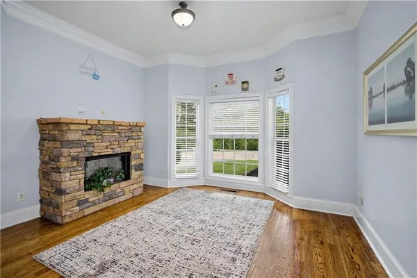 a view of entryway and hall with wooden floor