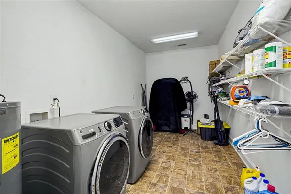 a bathroom with a sink a shower and a mirror