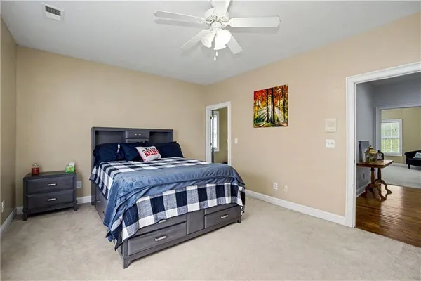 a aerial view of a house next to a yard