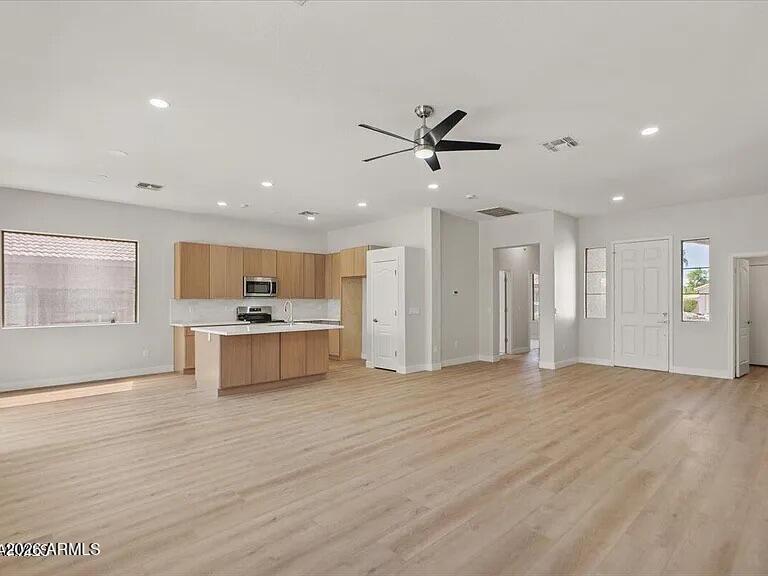 2918 East Harwell Road Gilbert, AZ 85234 - Photo 4 of 12 a view of a kitchen with a sink and a refrigerator