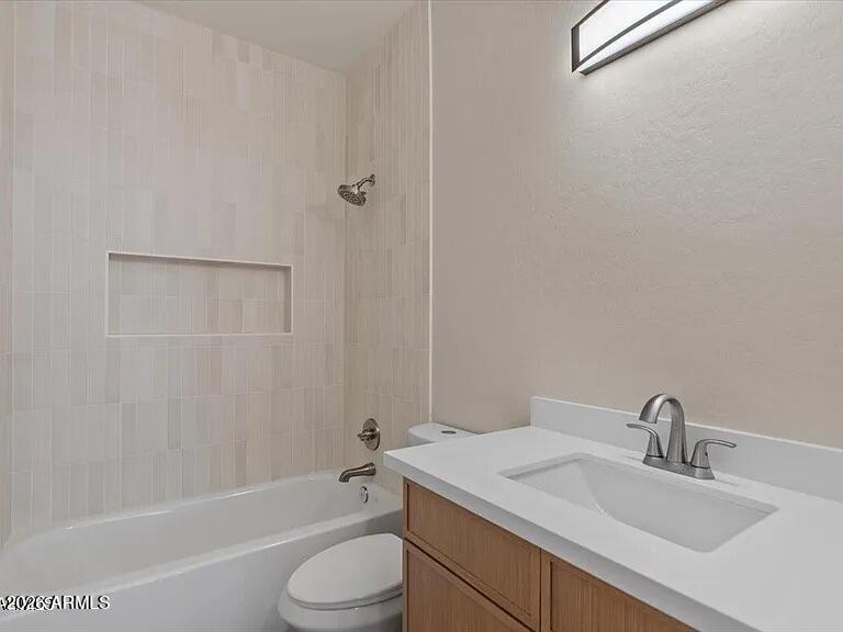 2918 East Harwell Road Gilbert, AZ 85234 - Photo 10 of 12 a bathroom with a granite countertop sink toilet and shower