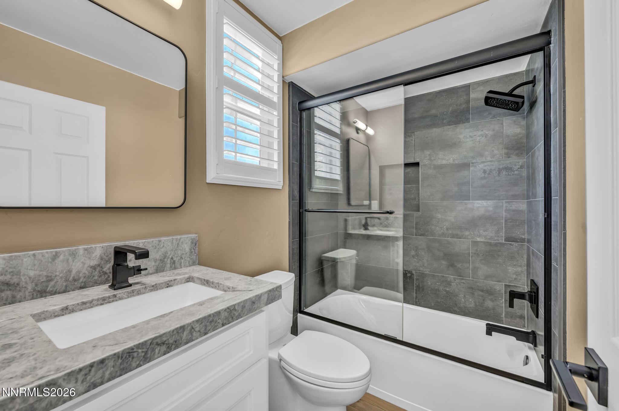 2965 Roundrock Court Reno, NV 89511 - Photo 14 of 40 a bathroom with a sink toilet and shower