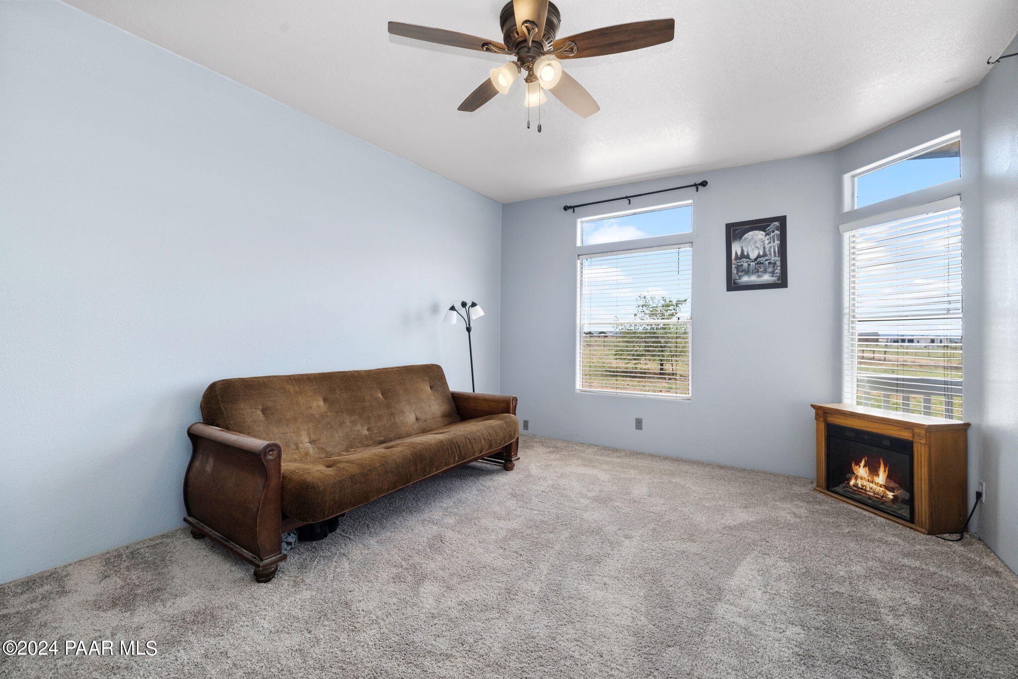24851 North Mitchell Road Paulden, AZ 86334 - Photo 17 of 38 a living room with furniture and a fireplace