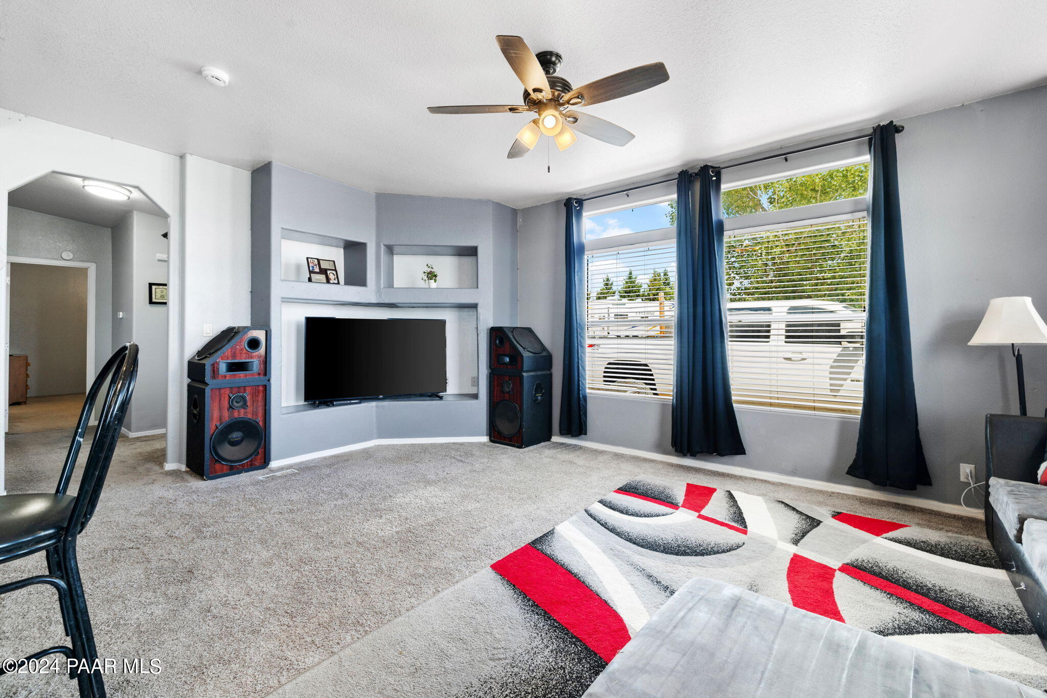 24851 North Mitchell Road Paulden, AZ 86334 - Photo 23 of 38 a bedroom with furniture and a flat screen tv