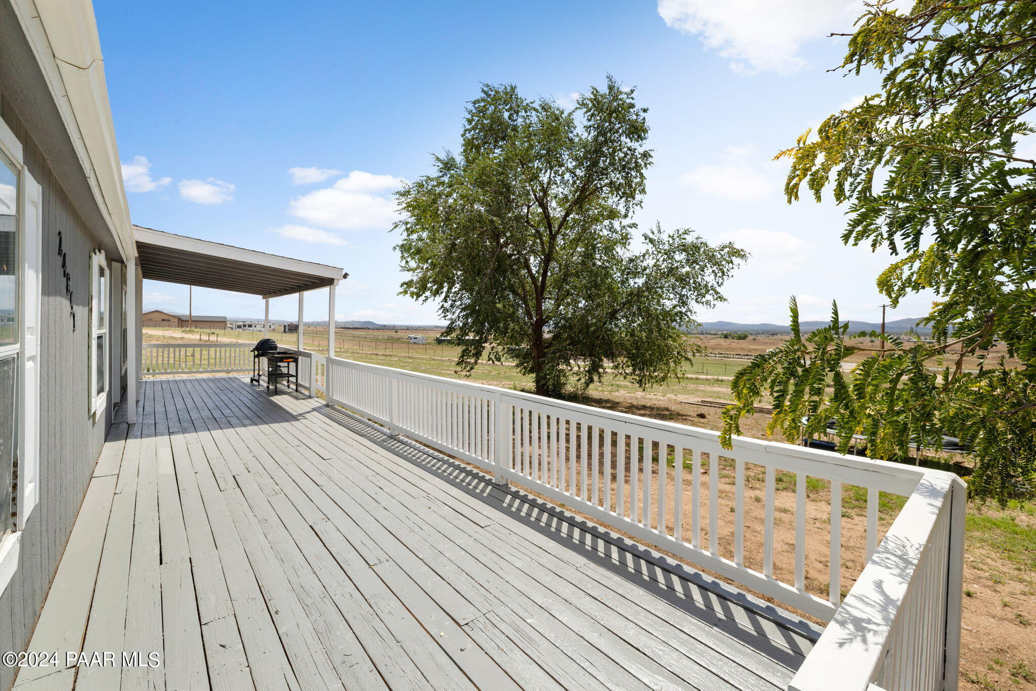 24851 North Mitchell Road Paulden, AZ 86334 - Photo 7 of 38 a view of balcony with wooden floor and outdoor seating