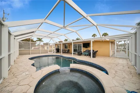 a view of a swimming pool with a patio