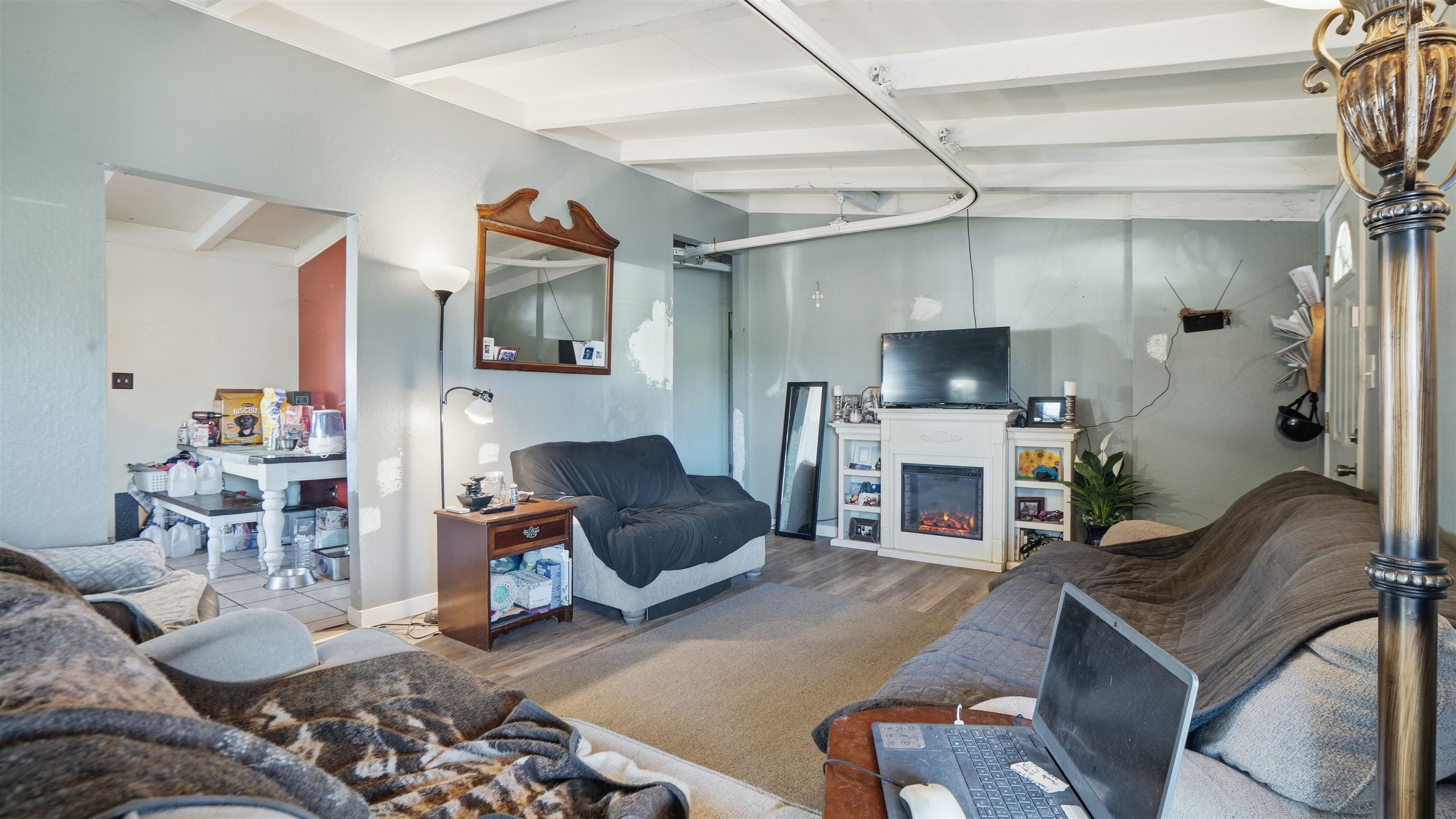 130 Sims Road Brentwood, CA 94513 - Photo 3 of 5 Living room with a glass covered fireplace and wood finished floors
