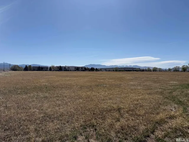 a view of a large body of water and mountain in the back