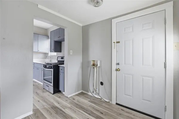 a kitchen with stainless steel appliances a refrigerator and cabinets