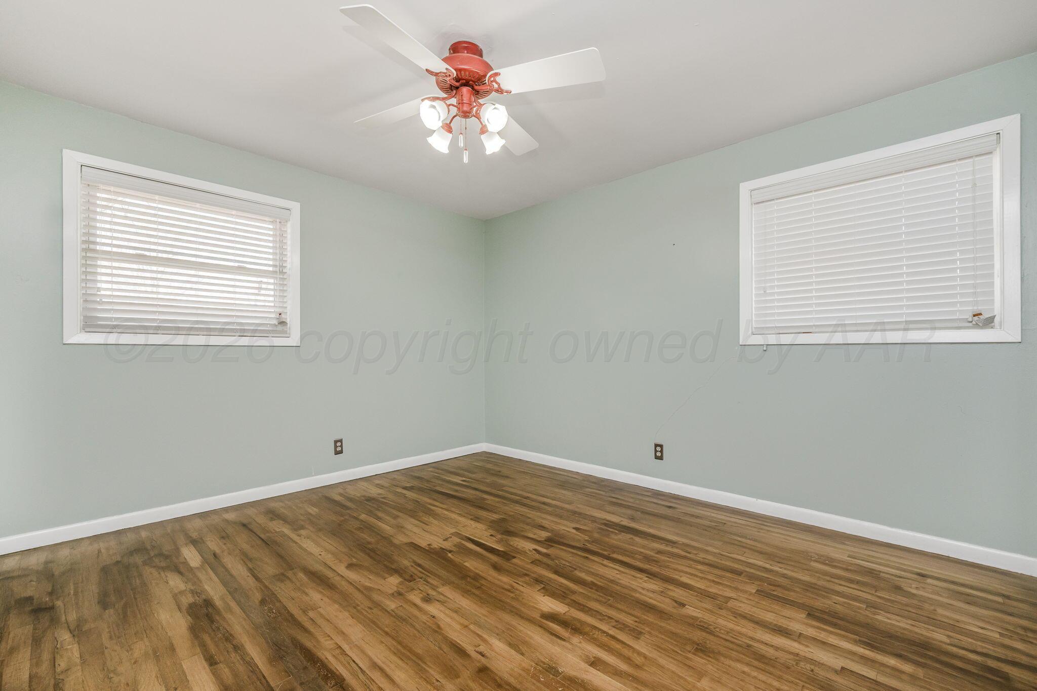 4305 Omaha Avenue Amarillo, TX 79106 - Photo 15 of 20 a view of a room that has a window and a ceiling fan