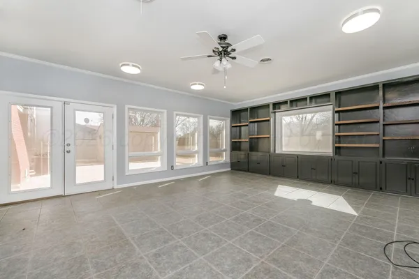 a view of an empty room with a window