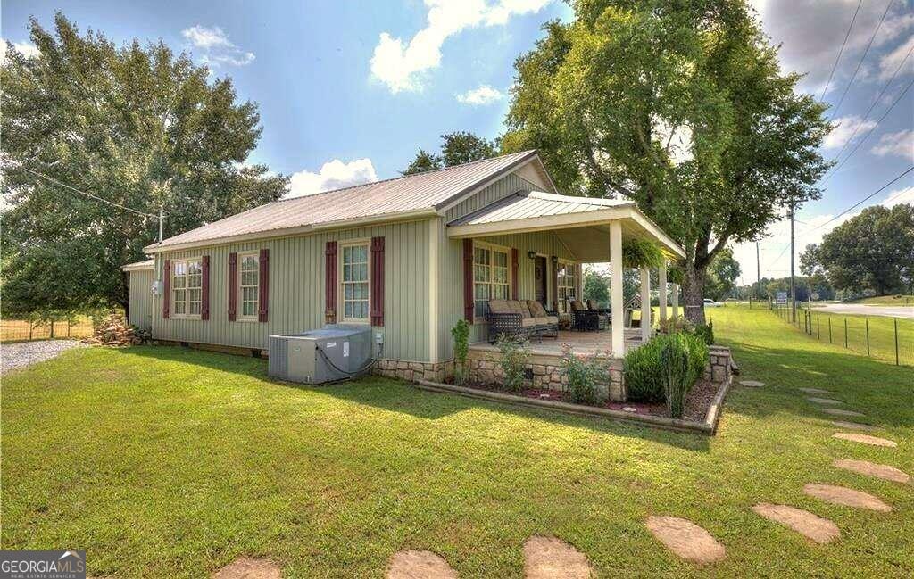 119 Spring Place Northeast Resaca, GA 30735 - Photo 1 of 1 a front view of a house with garden