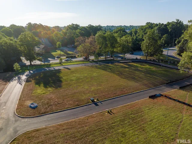 a view of swimming pool with a yard and mountain view