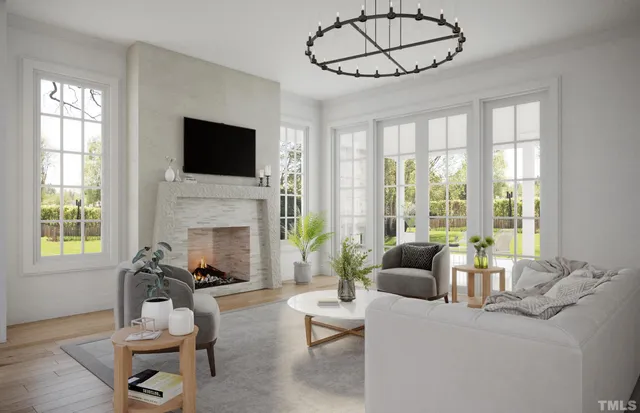 a living room with furniture a flat screen tv and a fireplace