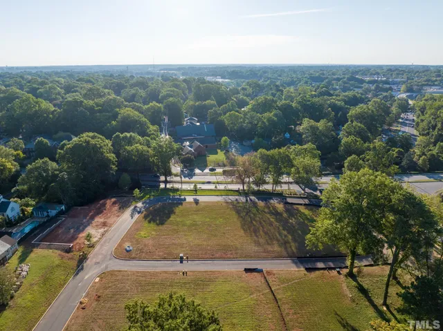 a view of a swimming pool with a yard