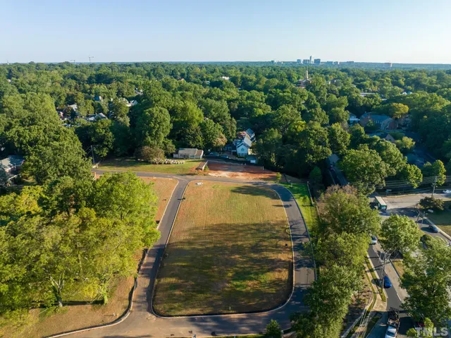 an aerial view of a residential houses with outdoor space