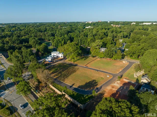 a view of a swimming pool and trees in the background