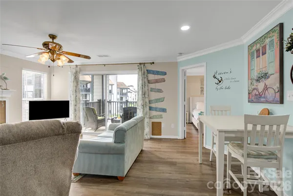 a bedroom with a bed couch and a large window