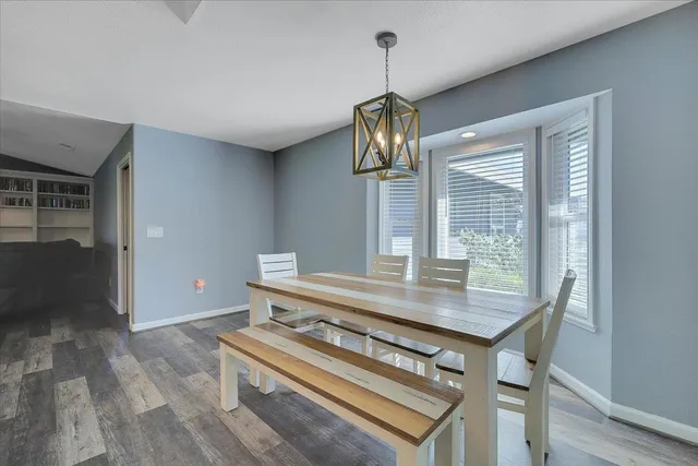 a view of dining room and wooden floor