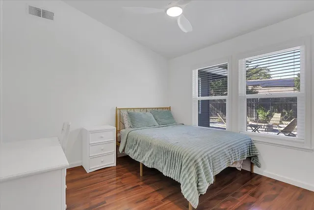 a bedroom with a bed and window