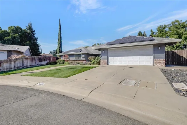 a view of a house with outdoor space and yard