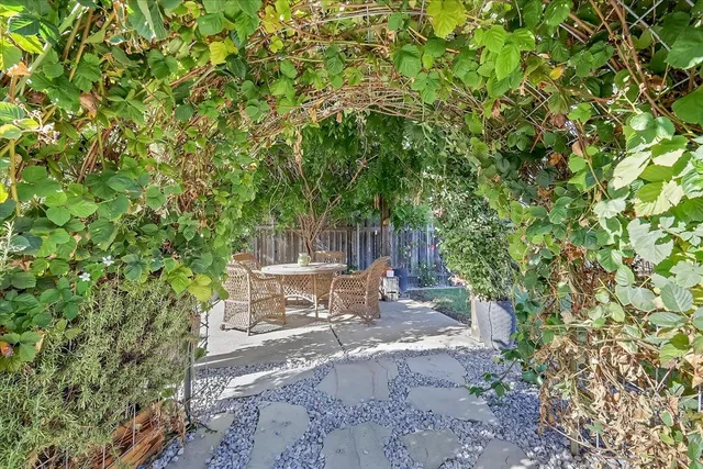 a view of backyard with sitting area