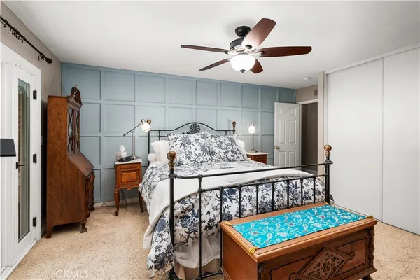 a bed room with a bed and a window