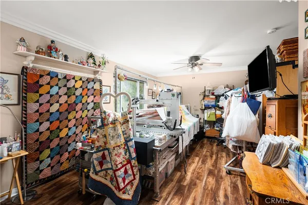 a view of a livingroom with furniture and a flat screen tv