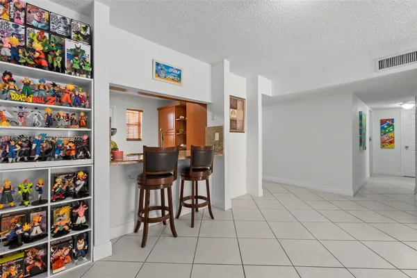 a living room with furniture and white walls