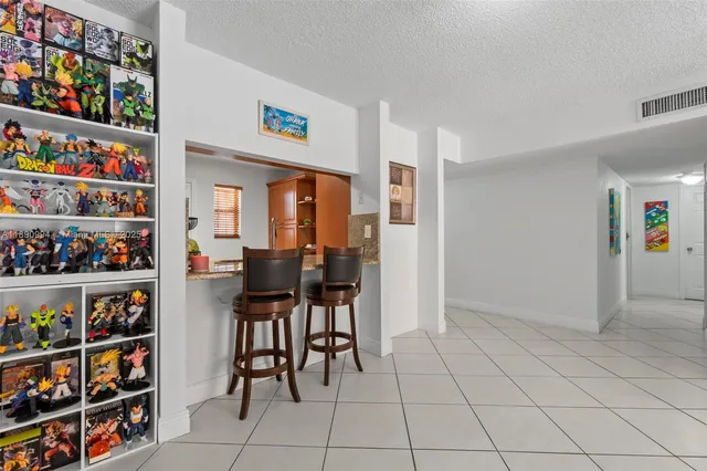 a living room with furniture and white walls