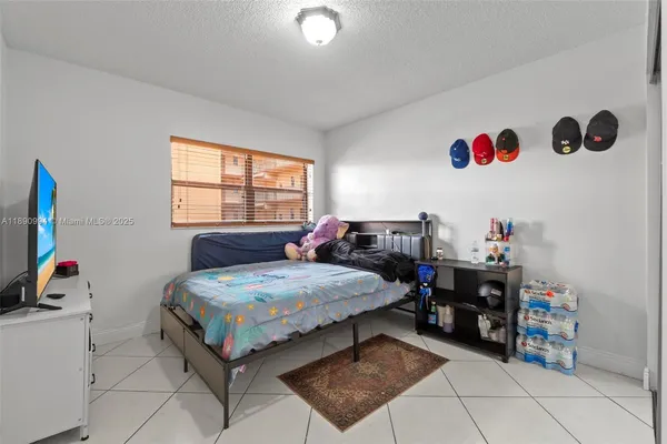 a bedroom with bed and walk in closet