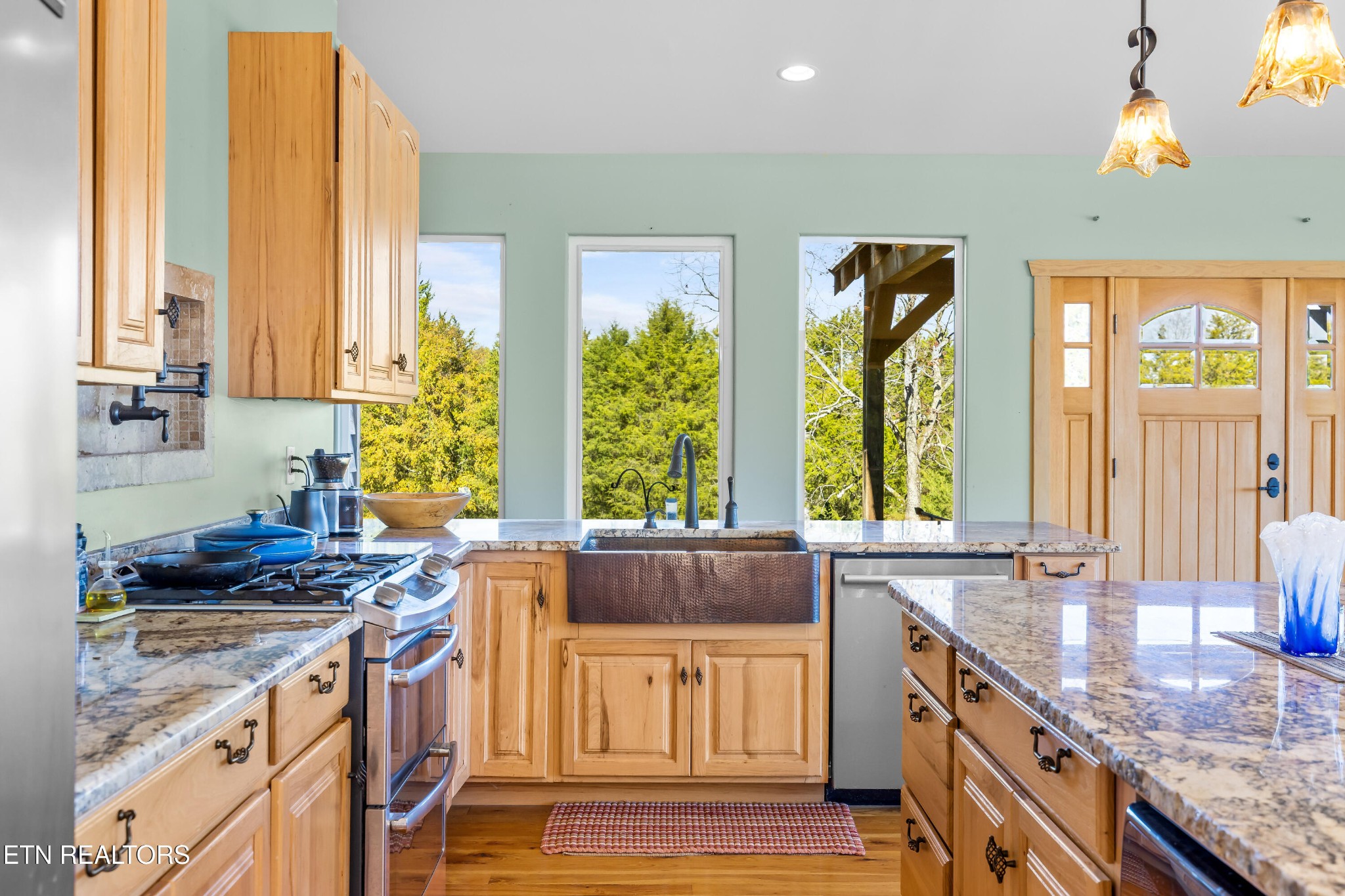 3070 West Fork Road Loudon, TN 37774 - Photo 11 of 48 a kitchen with stainless steel appliances granite countertop a stove a sink and a refrigerator