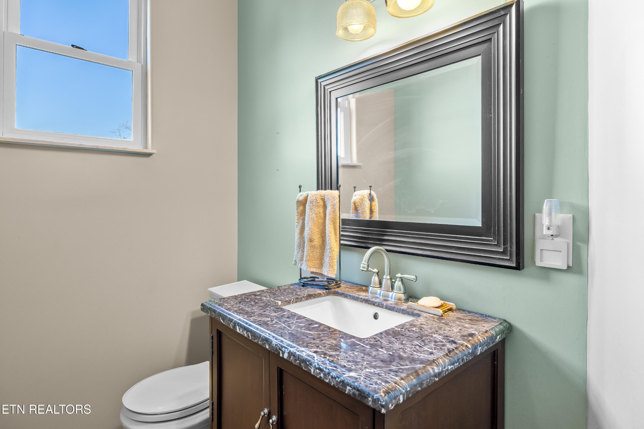 3070 West Fork Road Loudon, TN 37774 - Photo 20 of 48 a bathroom with a granite countertop toilet sink and mirror