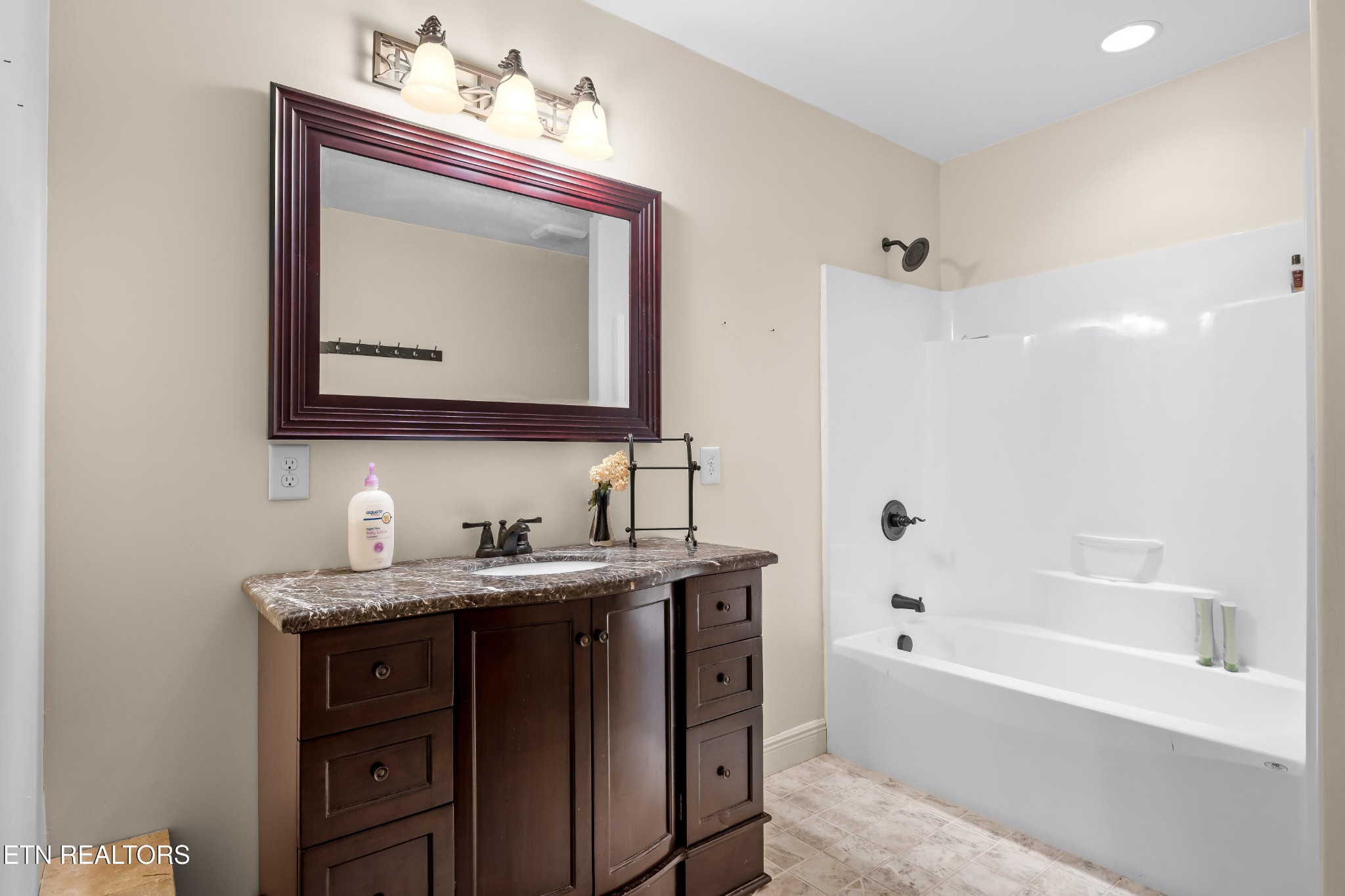 3070 West Fork Road Loudon, TN 37774 - Photo 26 of 48 a bathroom with a tub sink and mirror